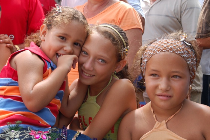 cuban girls dating. Three little girls wearing butterfly hair clips given to them by Roxanne