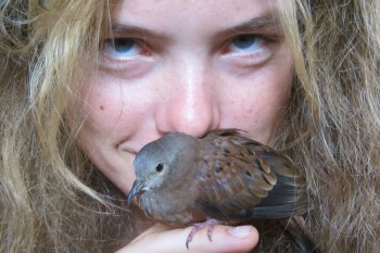 Roxanne with a baby dove which she rescued and then released, once it could fly