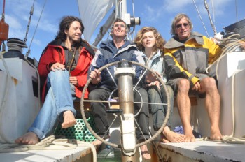 From R - L, The skipper, Rox, Tim (at the helm) and our Brazilian friend, Gean 