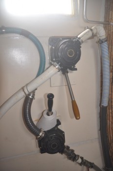 We replaced the crappy toilet pump with two heavy-duty bilge pumps.